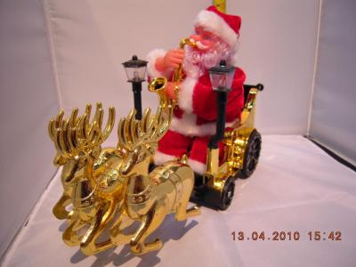 Santa Claus sitting deer cart Christmas decorations Christmas trees Christmas lights