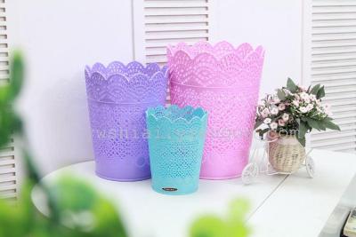 Plastic hollow flower-shaped trash can