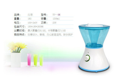 Mini air humidifier with fog on table in silent bedroom