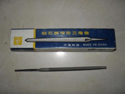 Narrow row triangular file with packing