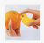 Bird Peel orange with orange-skinned helper home tour standing