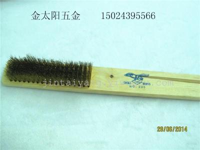 Wooden handle with brass brush