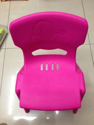 Green plastic baby chair seat