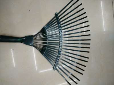 A dry leaf rake A garden tool