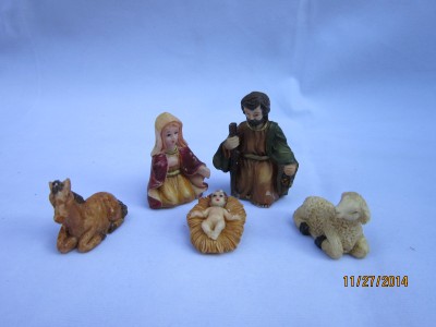 Christmas presents in a vintage Jesus Christ manger