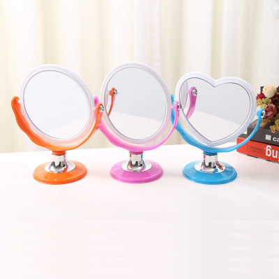Double - sided mirror with double - sided cosmetic mirror.