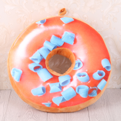 The donut pillow is pillow stuffed with plush toys.