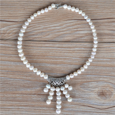The ancient silver pearl necklace tassel