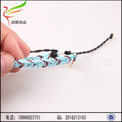 A plurality of colored wax cord woven bracelet pendant and leaves