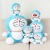 A Doraemon jingle cat plush toy doll machine cat pillow large light colorful music doll