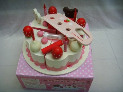 Wooden toys, birthday cake.