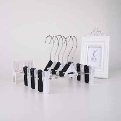 Large black and white triangle plastic trousers rack