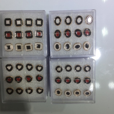 Two-color black, white and red drop oil ear studs