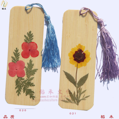 Large supply of tourist souvenirs real flowers flower bookmarks