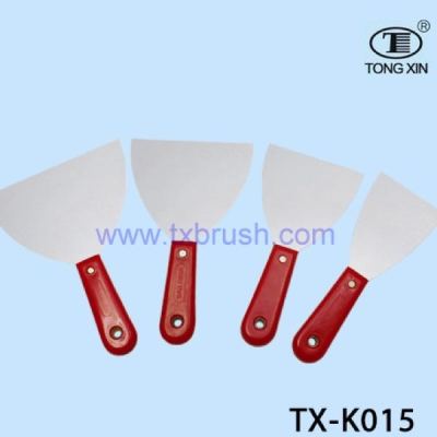 Red plastic handle putty knife.