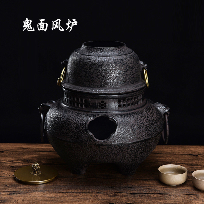 Charcoal cast iron ghost face wind stove tea stove charcoal teapot heating tea set suits