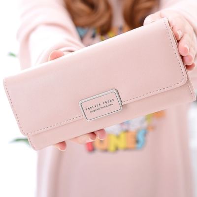 The new lady's long purse candy color is hand-held bag multi-card wallet hot style wallet factory
