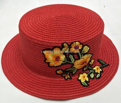 The new flat top hat is a fashionable embroidered applique summer bonnet