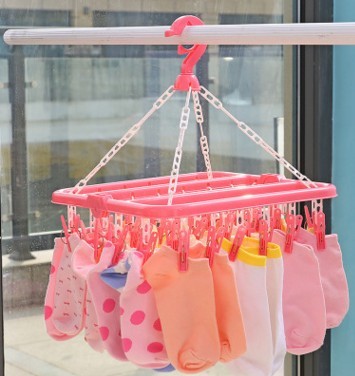 Taobao hot sale 32 clip can fold long adult clothes rack plastic multi - clip children sock frame.
