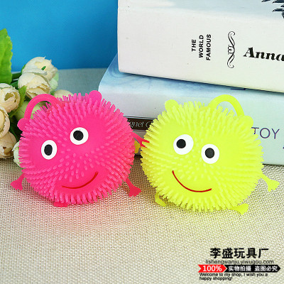 Colorful flash smiley face hair ball bounce off the ball in the night market children luminous small toys.