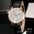 Rose gold Roma digital Dial fantasy blue glass strap watch ladies couple table
