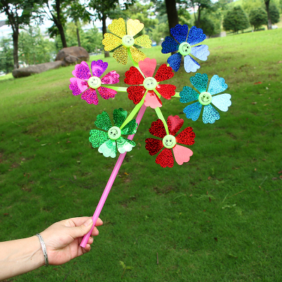 Best selling color wholesale seven smiling cartoon windmill windmill Ferris wheel plastic children's outdoor toys