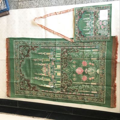 The Muslim and a prayer mat