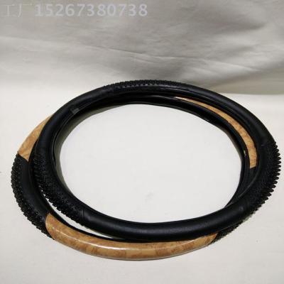 Artificial leather massage four seasons general steering wheel cover leather sets car supplies factory direct sales
