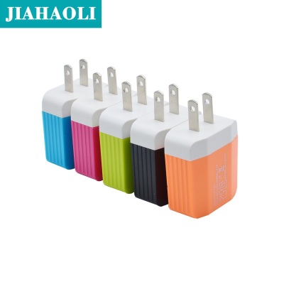 Double U candy color USB mobile phone general charger foot 1A band IC phone general.