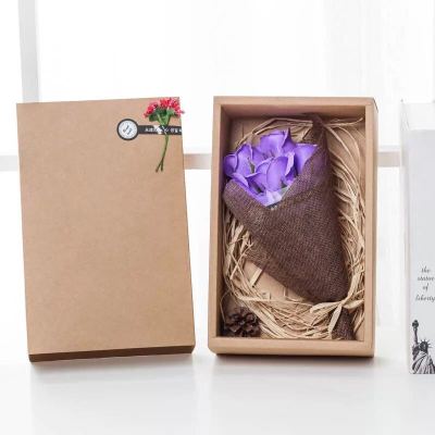Creative valentine's day birthday gift with bouquet of bouquet of soap and fancy box of brown paper with light.