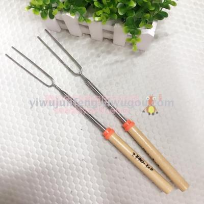 Telescopic wooden handle barbecue fork.