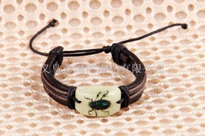 Resin insect specimen of cow leather braided rope bracelet.