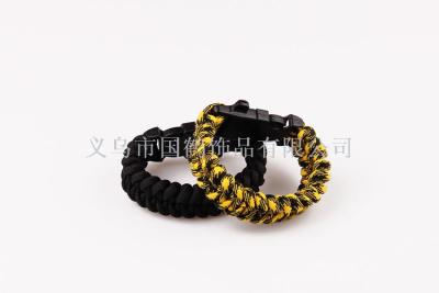 Multi-functional outdoor life saving magnesia stick with seven-core umbrella rope bracelet.
