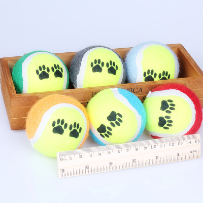 Factory direct selling pet tennis footprint dog dog grinding teeth to bite and throw training to wear small wholesale.
