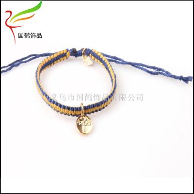 Double color bracelet with alloy leaf and peace tree adjustment.