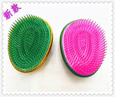Wholesale new fashionable and portable hairdressing comb sells gift massage comb color printed egg comb.