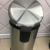 Circular stainless steel garbage can with pedal for the living room or hotel lobby 
