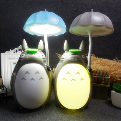 A small lamp with an umbrella, a small lamp, and a small night lamp.