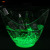 In a corner, there are 4L yuanbao luminous ice bucket transparent plastic light beer ice bucket.