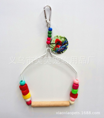 Small and medium-sized parrots play with colorful beads and swing bird toys.