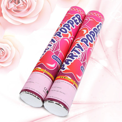 Wedding equipment scene is decorated with a spray ribbon sequins fireworks tube holding small fireworks