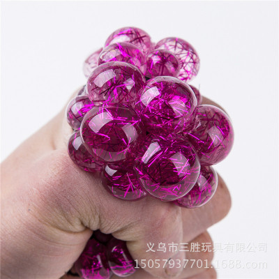 The golden silk crystal grape ball toy holds The colorful water ball and squeezes The creative craft to reduce pressure