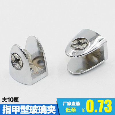 Thick zinc-alloy glass clamps are used to fix the plate
