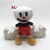 The new Cuphead adventure Cuphead game features a stuffed toy with action figures
