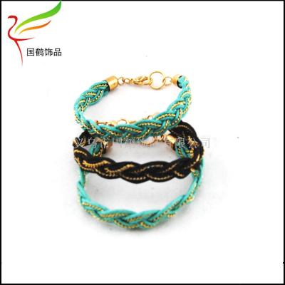 Students weave the chain bracelet