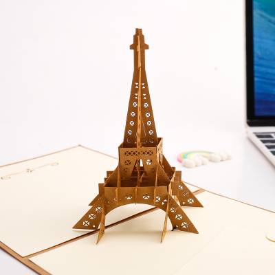Creative hollowed-out 3D paper carvings are made to customize the valentine's gift of the Eiffel Tower.