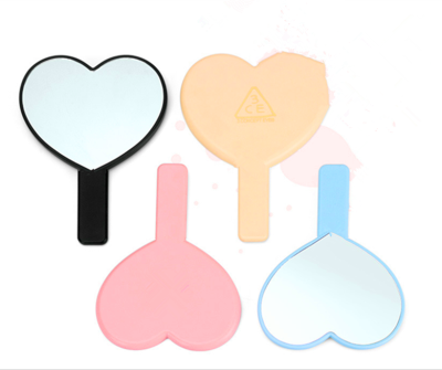 Wholesale new single-side heart-shaped hand mirror selling cosmetics daily necessities handle mirror gifts makeup mirror