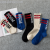 Popular logo socks harajuku port wind skateboard socks street BOOM letters stockings men's and women's striped stockings 