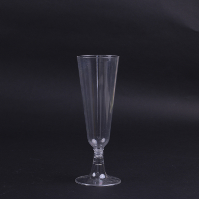 Single-use plastic cocktail party glass, glass of juice, glass of champagne and glass of red wine