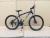 Bicycle 26 \"21\" high carbon steel frame double disc brake mountain bike factory direct sales